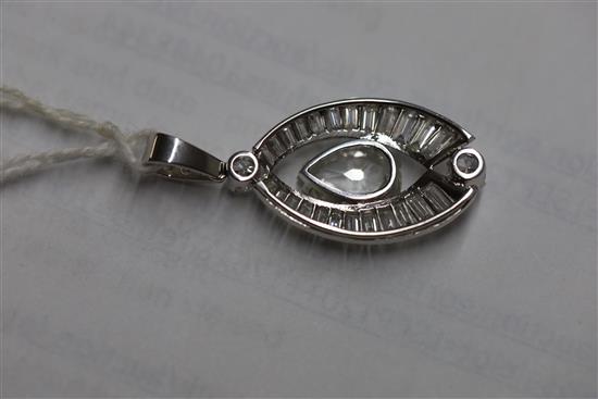 A platinum or white gold, pear, baguette and round cut diamond set elliptical shaped pendant,